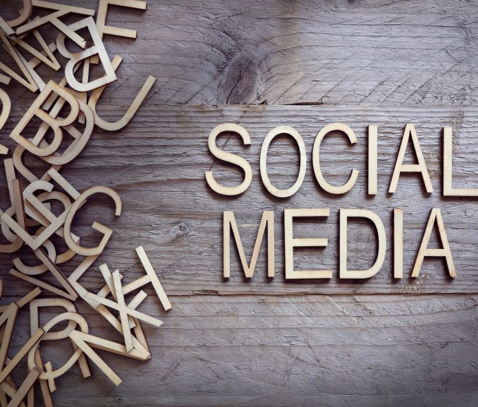 Social media and network concept wood letters on wooden background